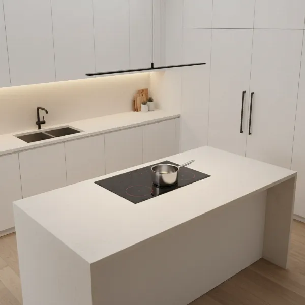 A sleek black Hestan 36-inch induction cooktop installed in a modern kitchen with a pot on one burner.